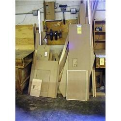 LOT OF LUMBER ALONG WALL