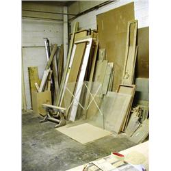 LOT OF LUMBER ALONG WALL