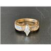 Image 1 : 14KT YELLOW AND WHITE GOLD ENGAGEMENT RING SIZE 7, SET WITH 14 BAGUETTE CUT DIAMONDS & ONE MARQUISE