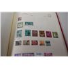 Image 11 : Stamp album - lots of stamps