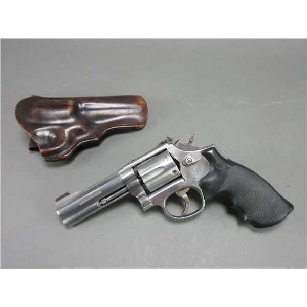 Smith And Wesson Model 617-1 Stainless Revolver- .22 LR- 4" Barrel- Synthetic Grips- Double Action- 