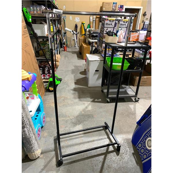 Rolling clothing rack with extending poles