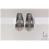 Image 1 : Ladies 14kt white gold and diamond earrings, set with .48cts of straight and tapered baguette cut di