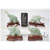 Image 1 : Four jade like elephant figures on camphor wood bases, each approximately 6"
