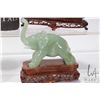 Image 4 : Four jade like elephant figures on camphor wood bases, each approximately 6"