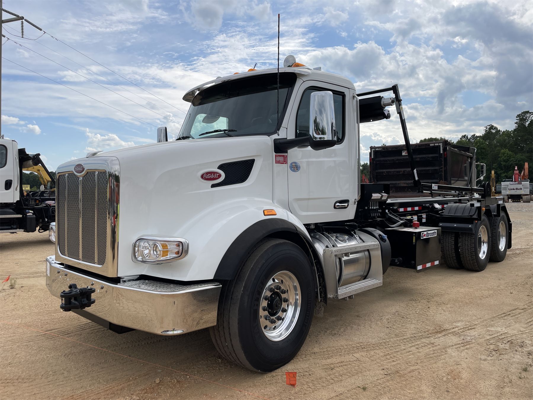 2025 PETERBILT 567 Roll Off Truck J.M. Wood Auction Company, Inc.