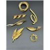 SEVEN GOLD TONE BROOCHES