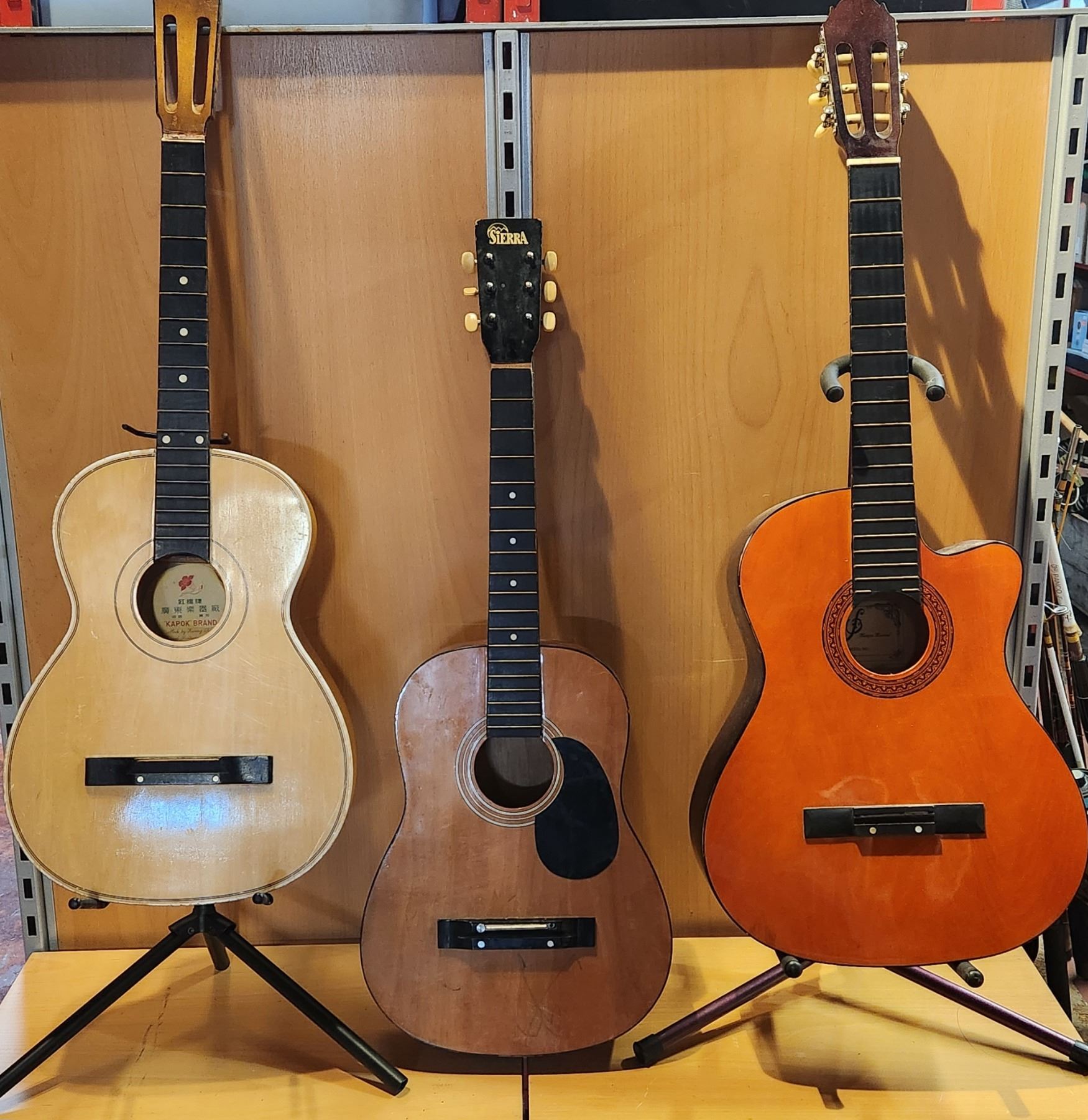 3 Stringless Guitars and 2 Guitar Stands