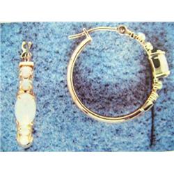 Opal hoop earrings 14 K yellow gold- opals are round and oval Cabochon approx. 1.25 carats, semi-tra