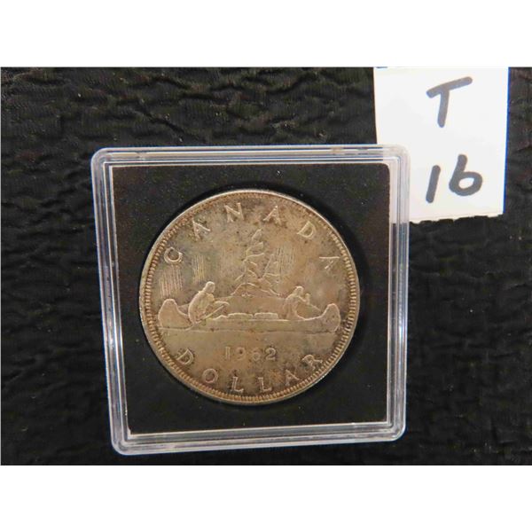 One 1962 Canadian 80% Silver Dollar, sealed in case. heavier toning around rim of obverse,