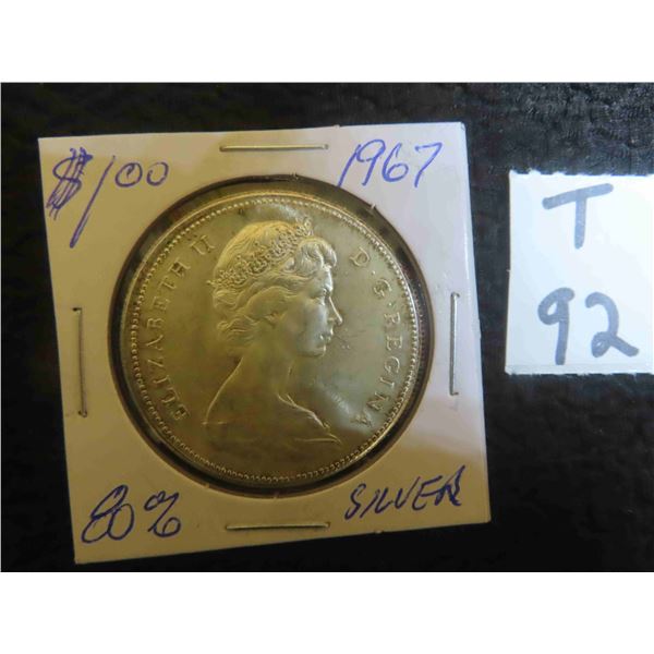 One 1967 Canadian 80% silver dollar, circulated and ungraded.