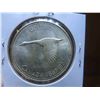 Image 2 : One 1967 Canadian 80% silver dollar, circulated and ungraded.