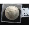 Image 1 : One 1967 Canadian dollar coin 80% silver, uncirculated, toning starting on obverse, reverse