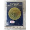 Image 1 : Expo 86 Official Medallion. Housed in a hard plastic holder.