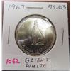 Image 1 : 1967 Canadian Silver 50 Cents. One Year Centennial Issue of a howling wolf. MS-63. Bright White.