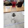 Image 1 : Clear glass oil lamp, with red tipped chimney