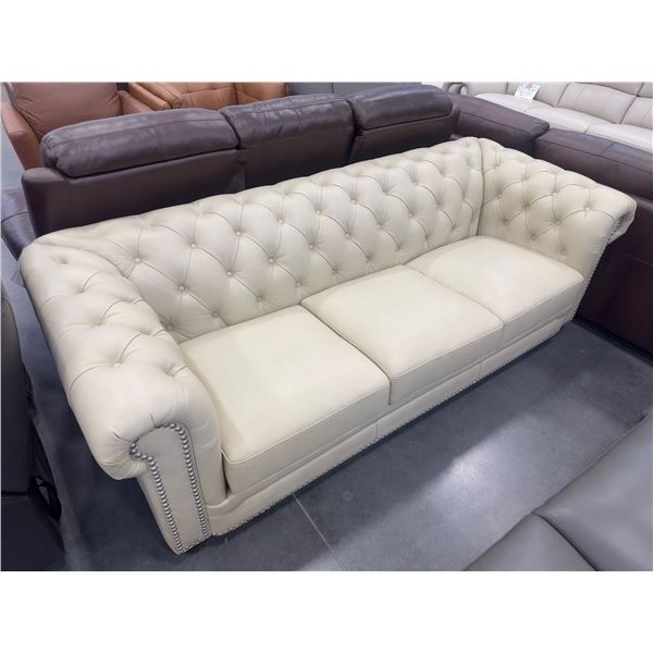 Amax Leather Tufted rolled arm sofa with nailhead design cream colour (floor model) - size 90''w ken