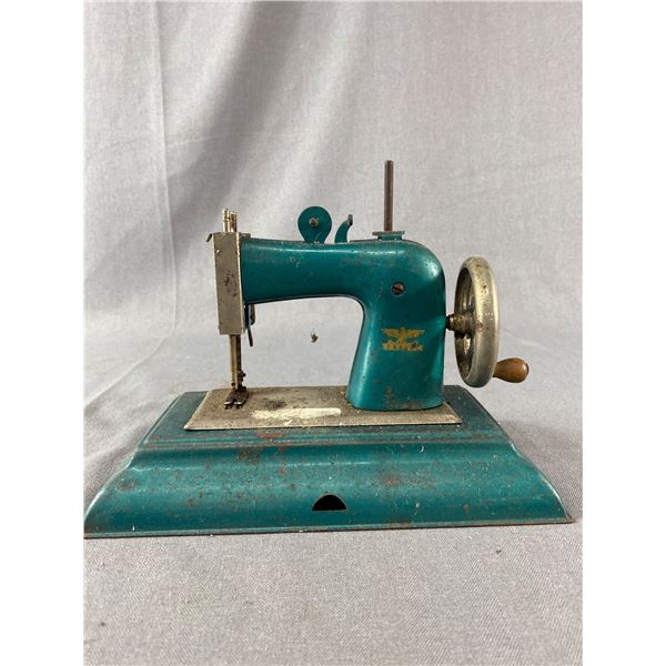 Vintage Mini Metal Casage Sewing Machine. Approx. 9 3/4" L x 6" T