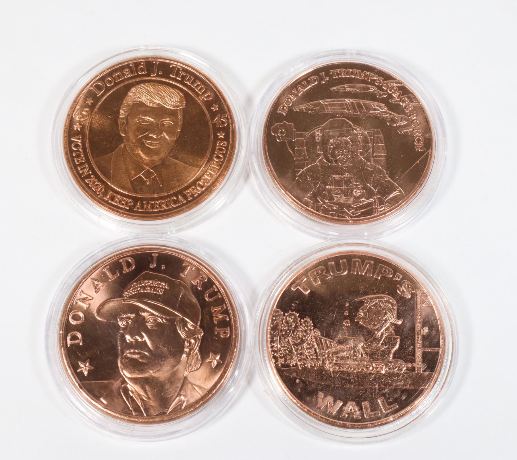 FOUR 1-OZ TRUMP THEMED COPPER ROUNDS IN CAPSULES