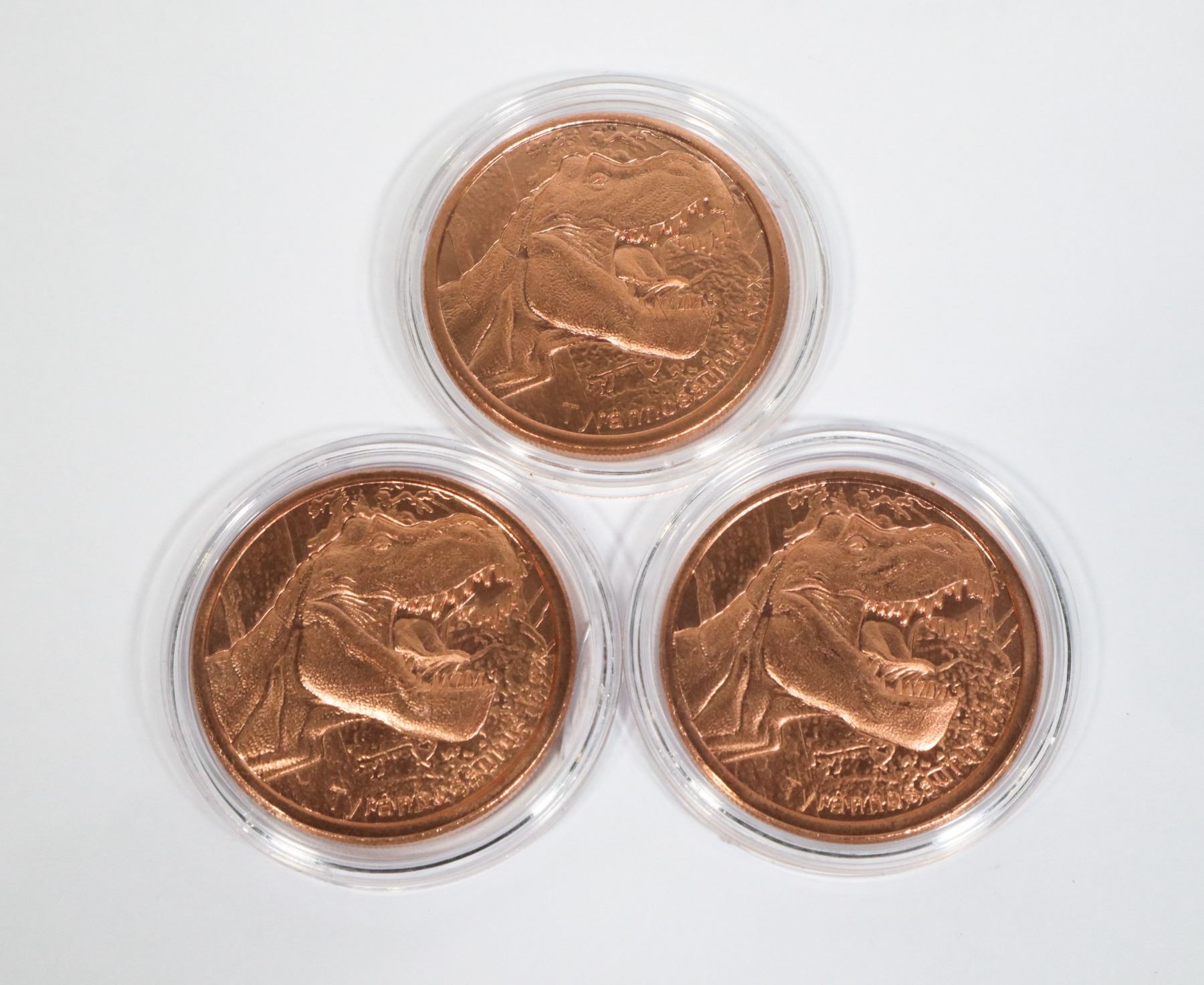 THREE TYRANNOSAURUS REX COPPER ROUNDS IN CAPSULES
