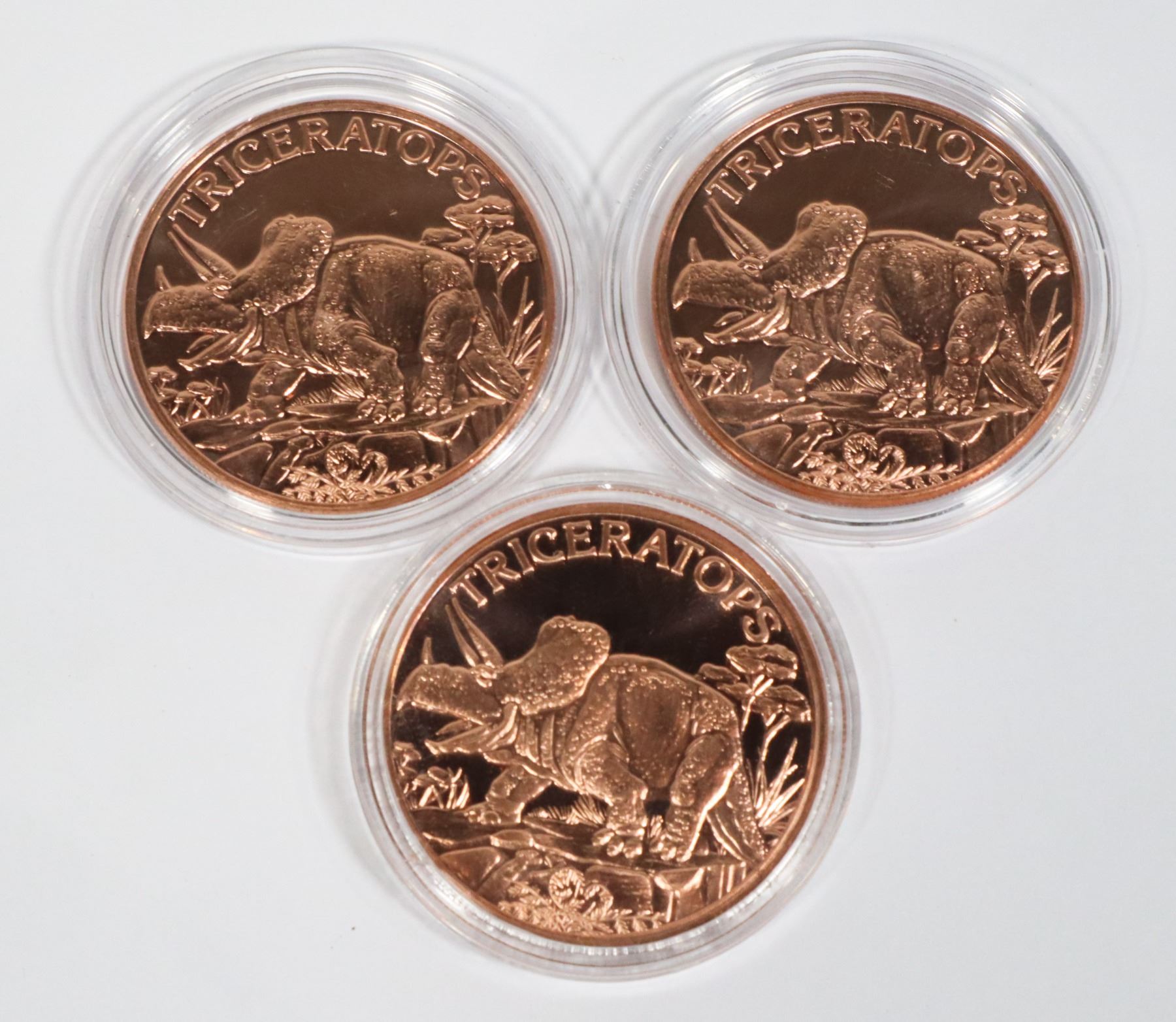 THREE 1-OZ TRICERATOPS COPPER ROUNDS IN CAPSULES