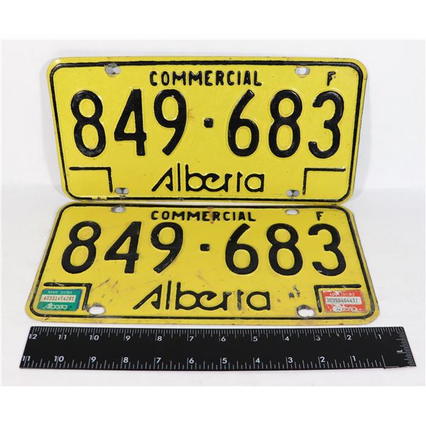 PAIR OF YELLOW COMMERCIAL ALBERTA LICENSE