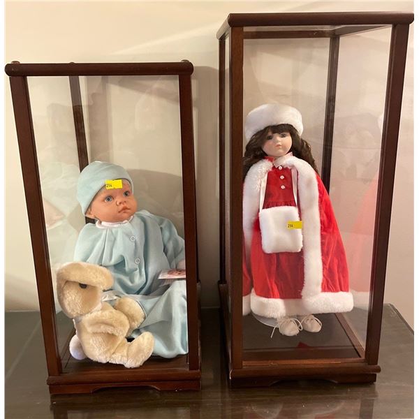 Collection Of Collectible Dolls In Display Cases 9Lx11Dx22H