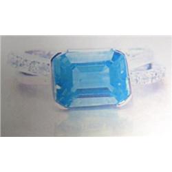 Blue topaz and diamond lady's ring 14 K white gold- blue topaz is emerald cut approx. 2.50 carats, t