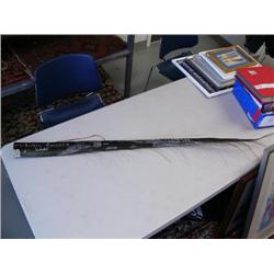 Beautifully scrimshawed baleen of Arctic scene- whale, polar bear, and Eskimo man kayaking by Mary K