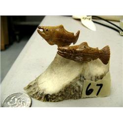 Very well scrimshawed bone salmon on antler base (2)