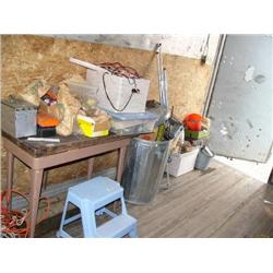 Small table; trash can; tool boxes; extension cords; tools; nails; saws; blue plastic step stool (81