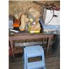 Image 2 : Small table; trash can; tool boxes; extension cords; tools; nails; saws; blue plastic step stool (81