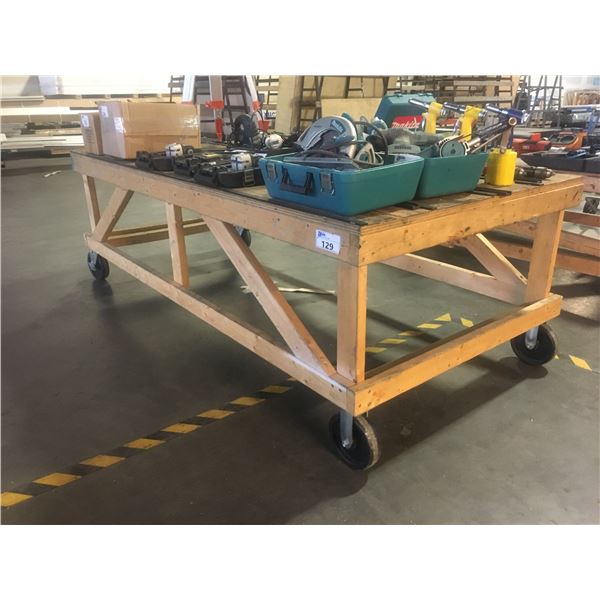 LARGE WOODEN ROLLING WORK TABLE - APPROX. 4FT X 8FT X 2 1/2FT HIGH