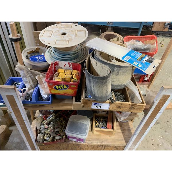 MOBILE WOODEN WORK BENCH (APPROX. 4'W X 2'D X 3.5'H) WITH ASSORTED HARDWARE & SANDING BELTS