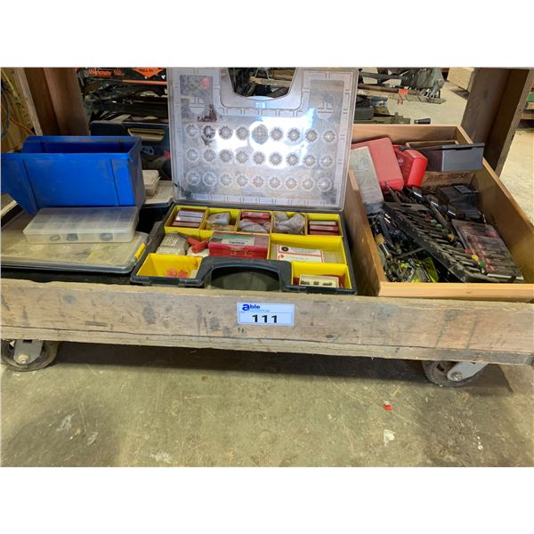 MOBILE WOODEN WORK BENCH (4.5'W) WITH A LARGE LOT OF BITS & ELECTRICAL PIECES