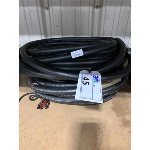 TWO COILS OF BLACK HIGH PRESSURE HOSE