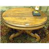 Image 1 : Walnut Oval Pedestal Coffee Table