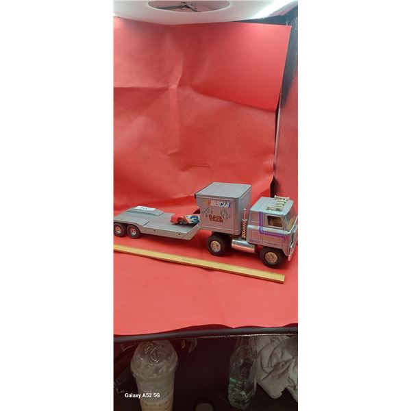 Vintage ERTL pressed steel race hauler with car (car missing 2 wheels)  20"