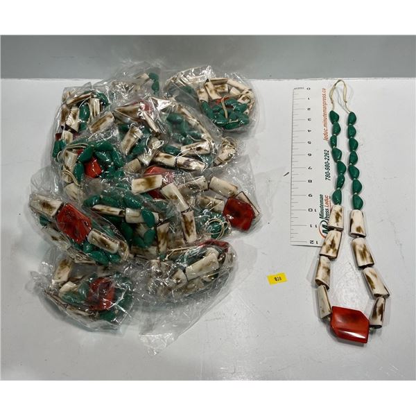 Leather Strand with "Bone", Green, and Red Beads  23 pieces
