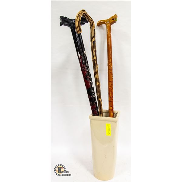 4 HANDMADE CANES IN PORCELAIN STAND