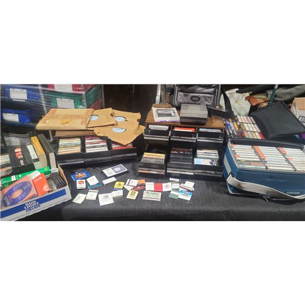 LARGE LOT OF CASSETTE TAPES, POLAROID SPECTRA SYSTEM CAMERA, VHS, AND LAS VEGAS HOTEL MATCHES