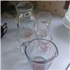 Image 1 : 2 WATER PITCHERS AND 3 MEASURING CUPS