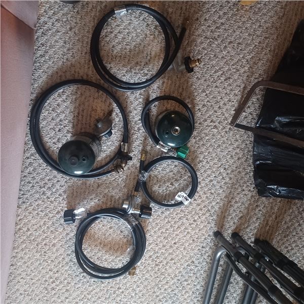 ASSORTED PROPANE HOSES, REGULATORS AND 2 PROPANE BOTTLES
