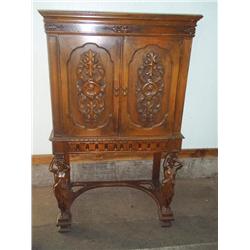 Ornate walnut cabinet