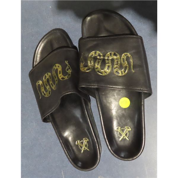 Pair of leather sandals, size 10 unisex golden snake design on black leather, crossed nails on soles