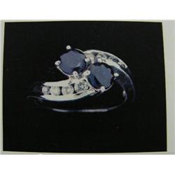 Sapphire and diamond Lady's Ring 14 K white gold- sapphires are round, faceted approx. 1.00 carats, 