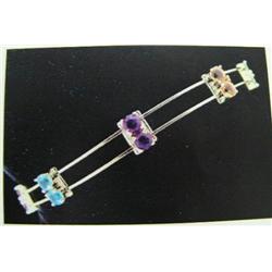 Multigemstone Bracelet 14 K yellow gold- period, amethyst, garnet, blue topaz, and citrine are round