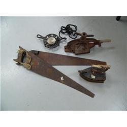 2 wood saws; old coal fire iron; cast iron warming tribit; cast iron clamp (2)