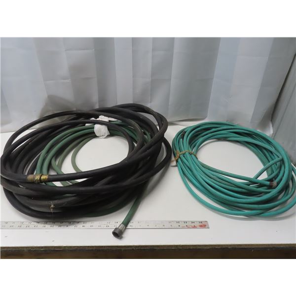 three rolls of garden hose