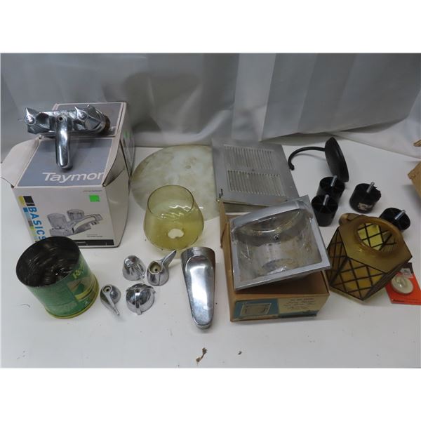 box with faucets , lights , misc. plumbing parts